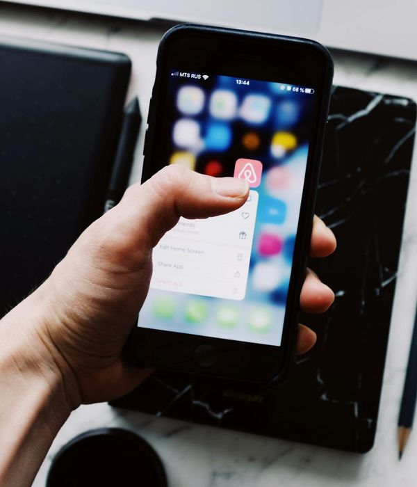 Professional mobile application development workspace with iOS and Android devices